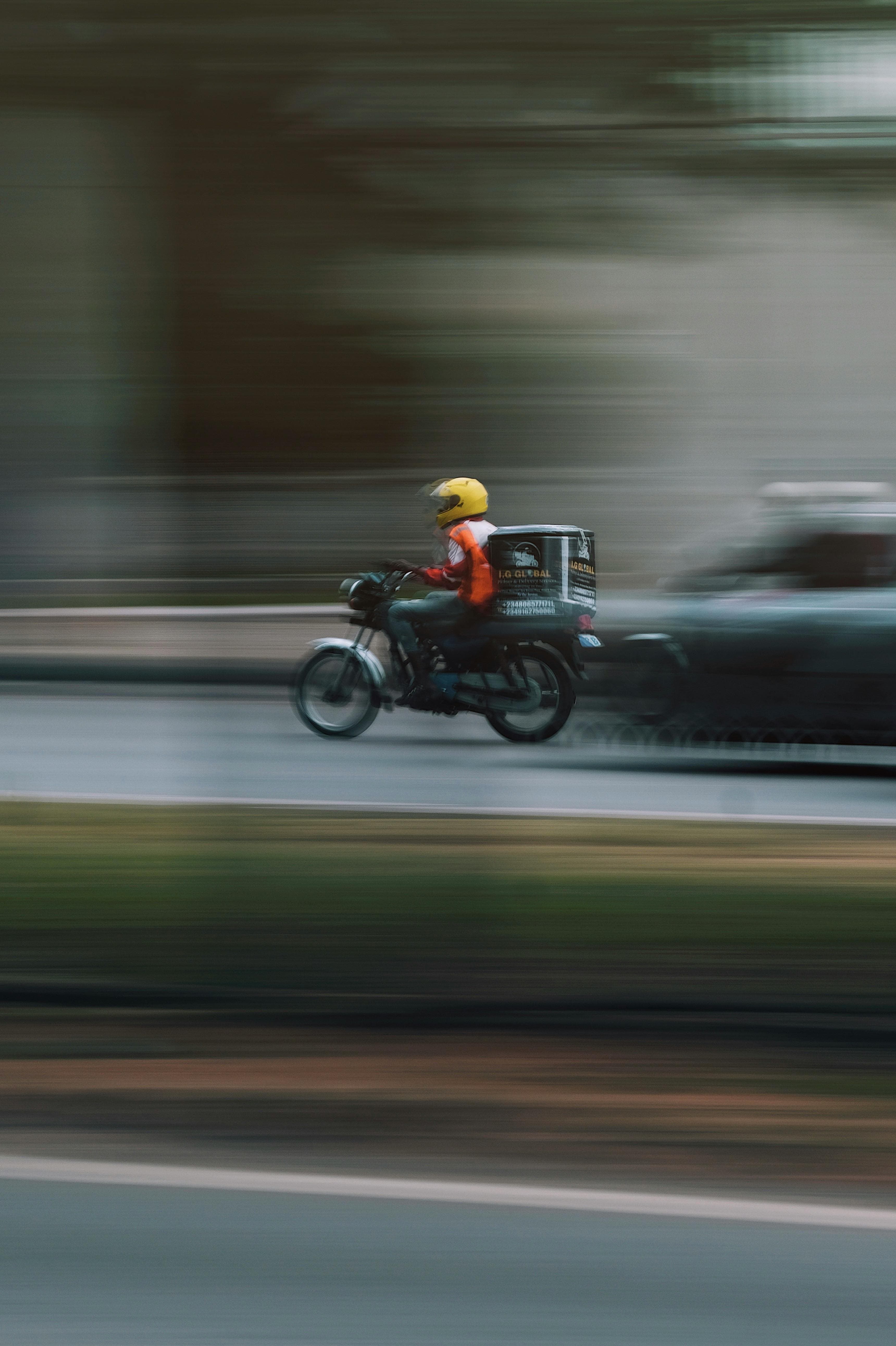 motobike in motion delivery, moving very fast.